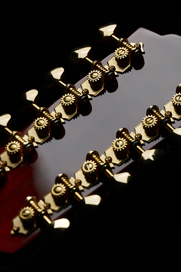 Close-up of F-512E Natural back of headstock and gold tuning pegs