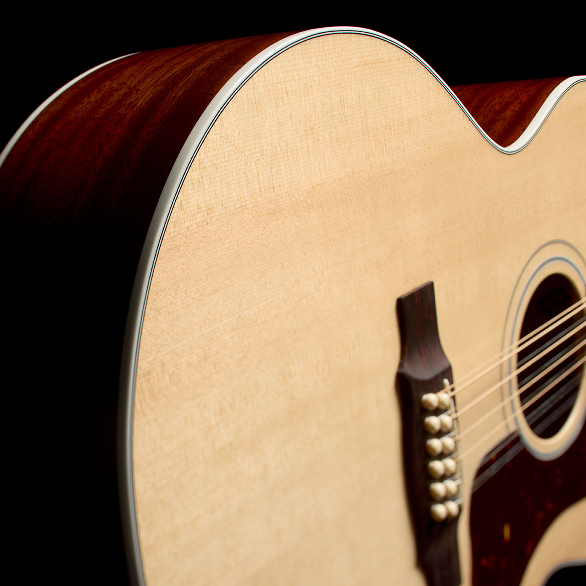 Close-up of F-412 Standard Natural body side curve thumb