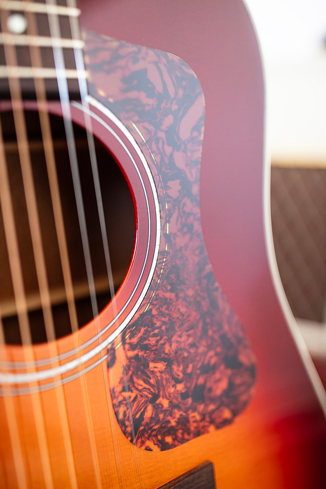 Close up of D-140 Cherry Burst pickguard