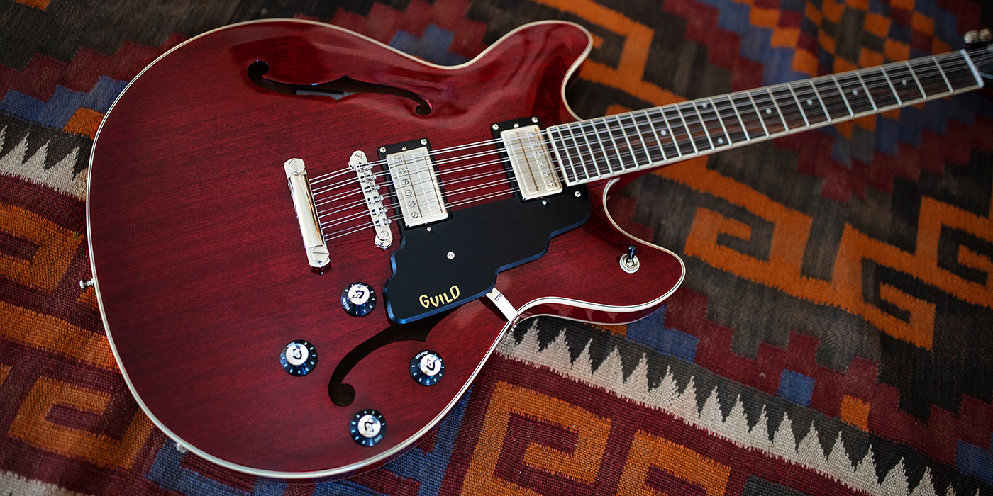 Starfire I-12 Cherry Red laying on a colorful rug