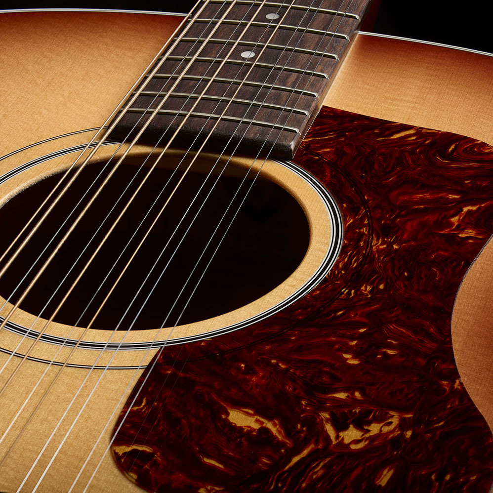 Close-up of F-412 Standard Pacific Sunset Burst soundhole and pickguard thumb
