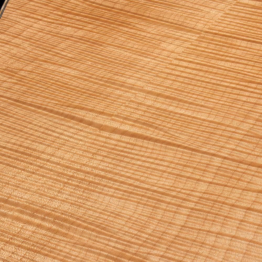 Close-up of VR1 F-40 Au Naturel back showcasing ultra-rare aged solid 5A flame maple thumb