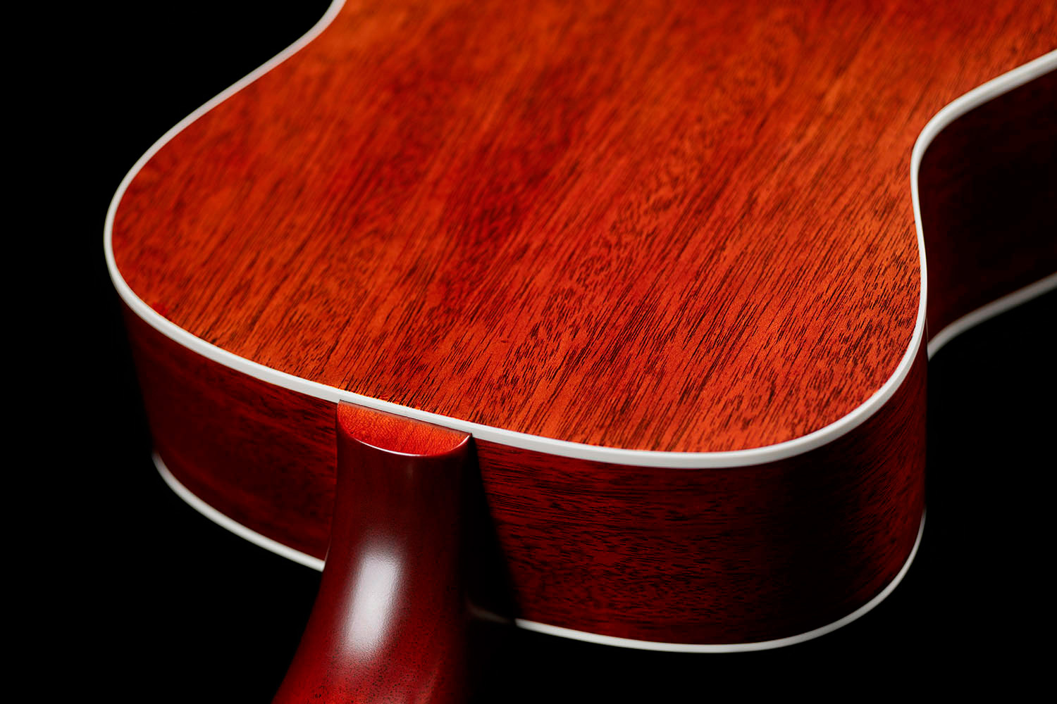 Close-up of M-40 Standard Natural heel showcasing solid African mahogany back and sides