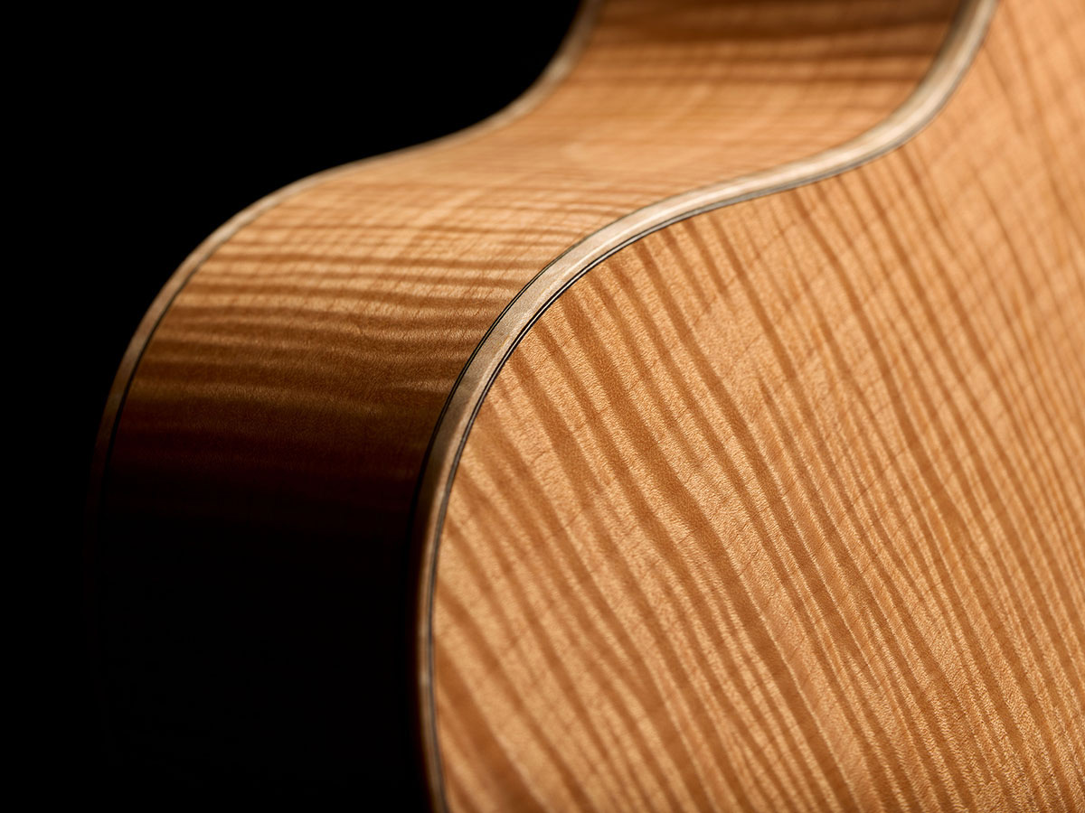 Close-up of VR1 F-40 Au Naturel guitar’s back and sides showcasing the aged solid 5A flame maple