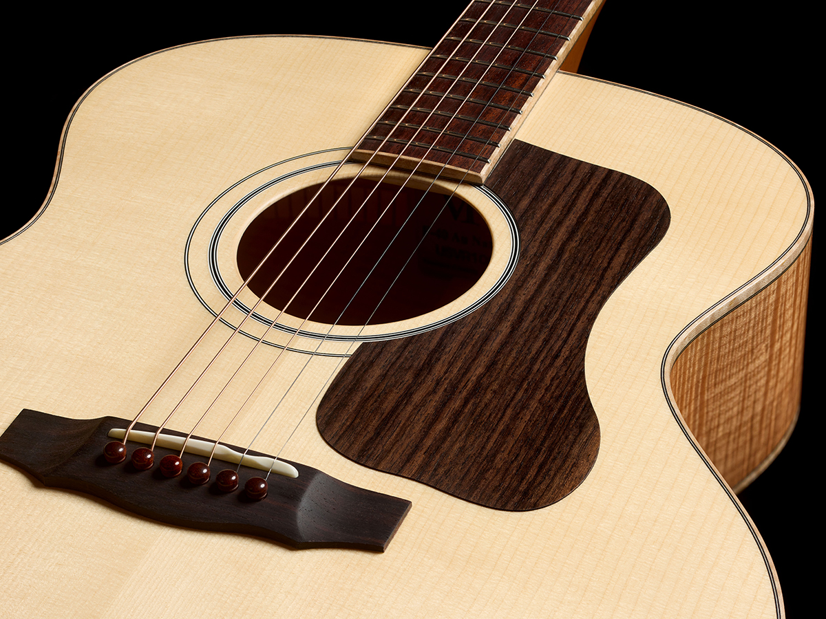 Close-up of VR1 F-40 Au Naturel Indian rosewood bridge with Waverly snakewood bridge pins