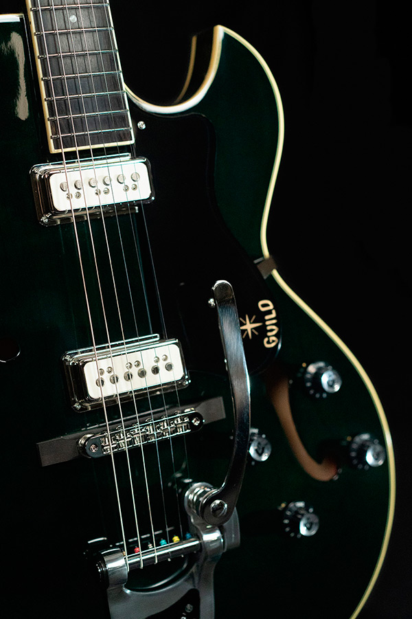 Close up view of Starfire III Dynasonic Emerald Green body and pickguard thumbnail