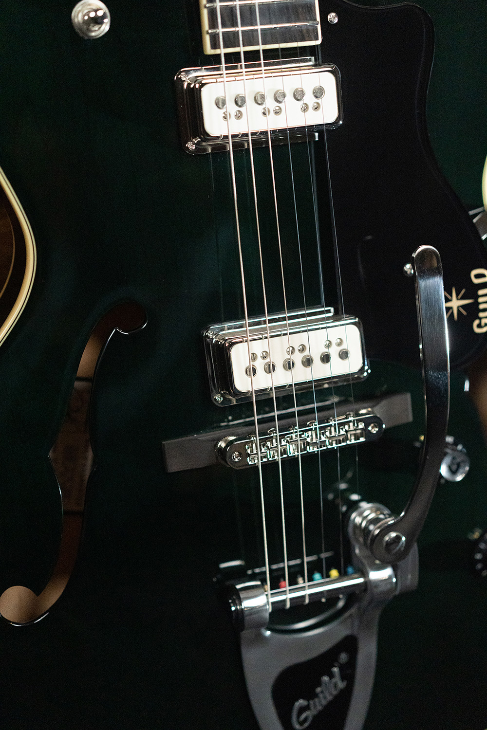 Close up view of Starfire III Dynasonic Emerald Green pickups and bridge