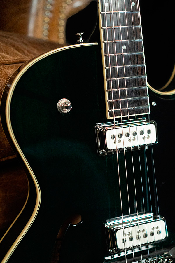 Close up view of Starfire III Dynasonic Emerald Green body curve, pickups and stings thumbnail