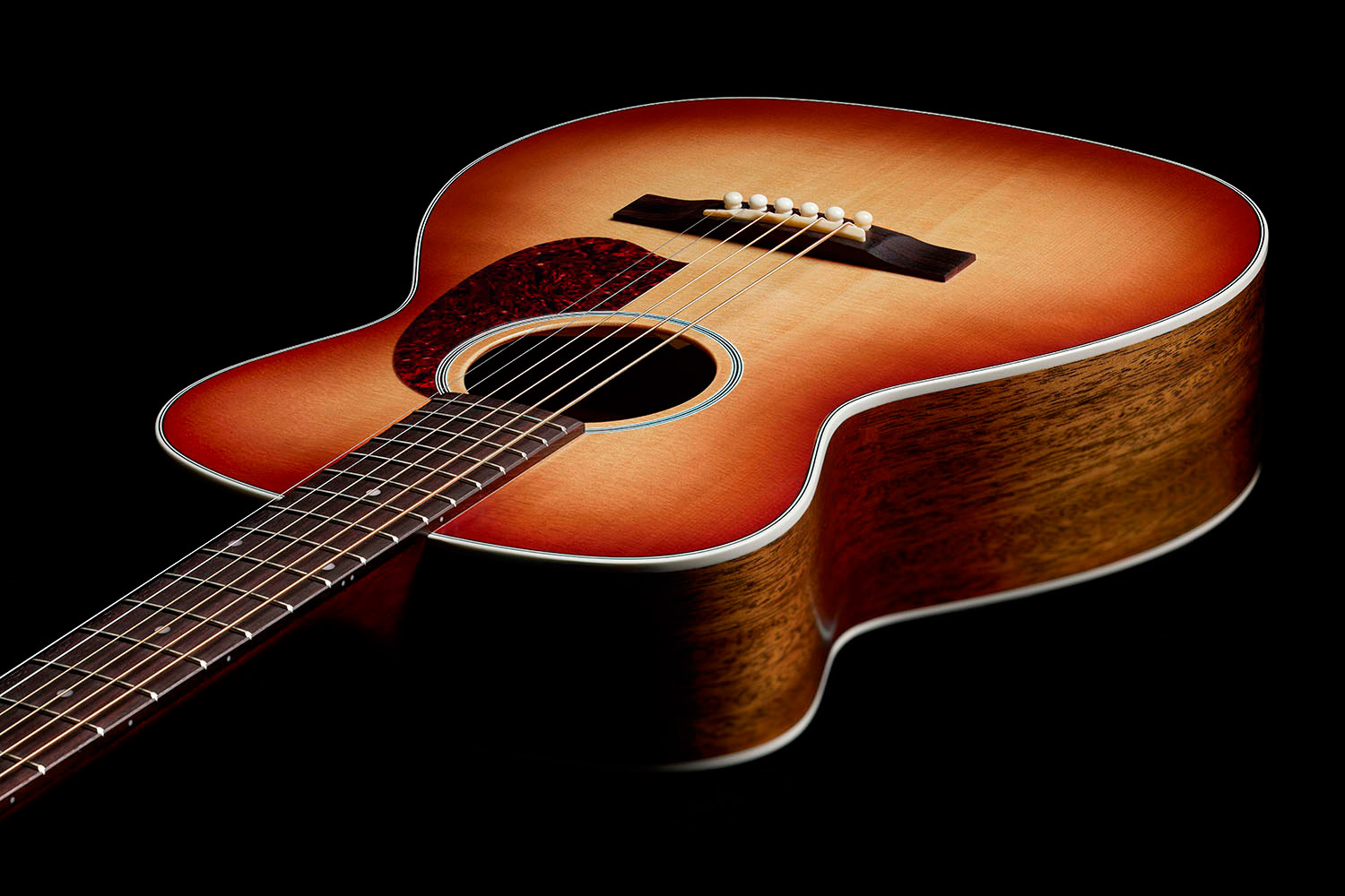 View of M-40 Standard Pacific Sunset Burst body showcasing solid Sitka spruce top and solid African Mahogany sides
