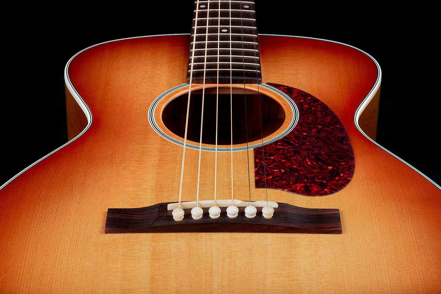 View of M-40 Standard Pacific Sunset Burst body showcasing solid Sitka spruce top