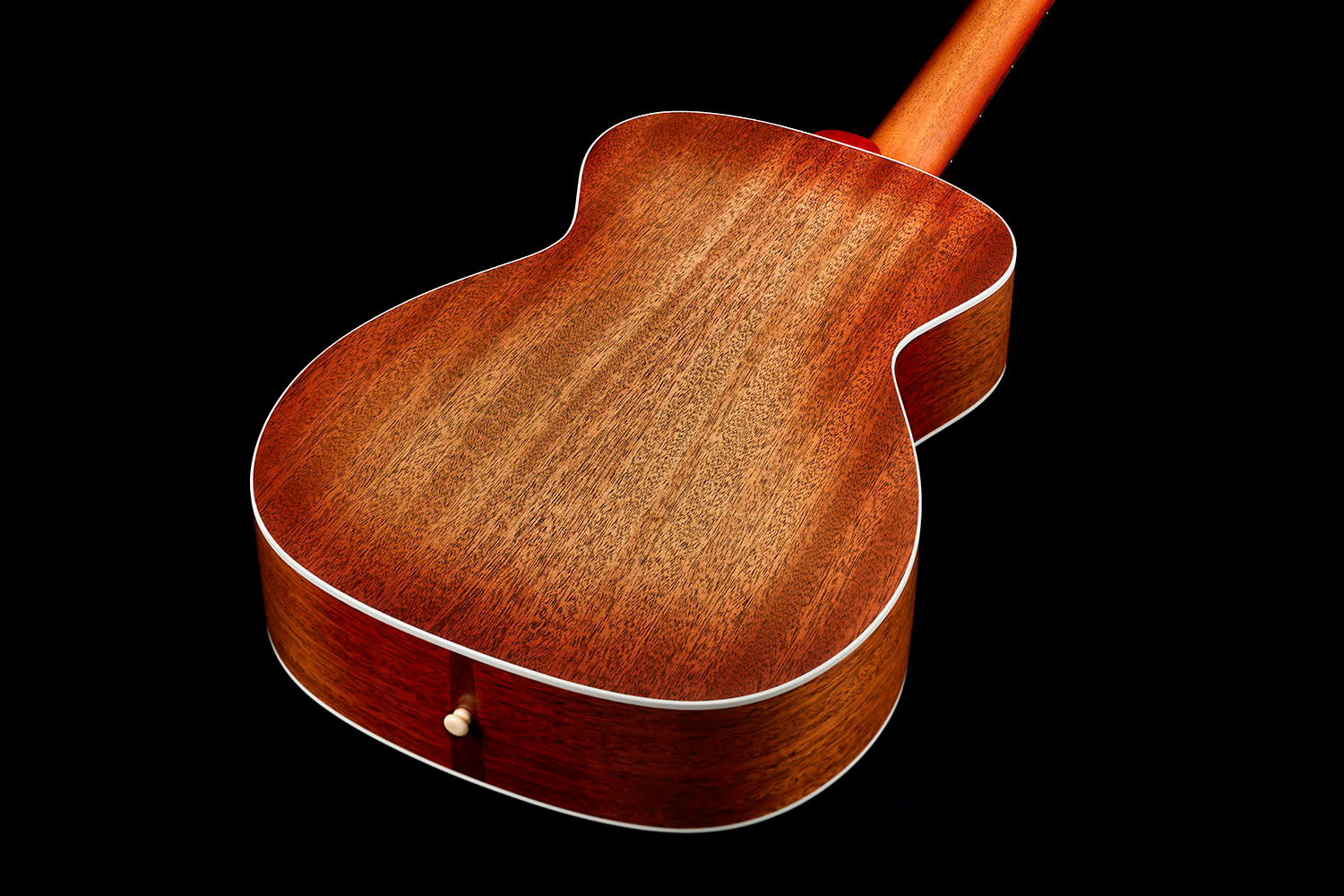 View of M-40 Standard Pacific Sunset Burst back showcasing solid African Mahogany back and White ABS body binding