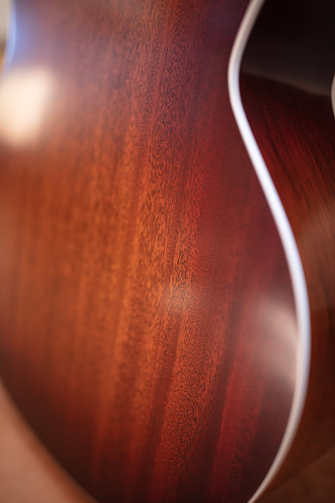 Close-up of F-40 Standard Pacific Sunset Burst body back highlighting solid African mahogany back