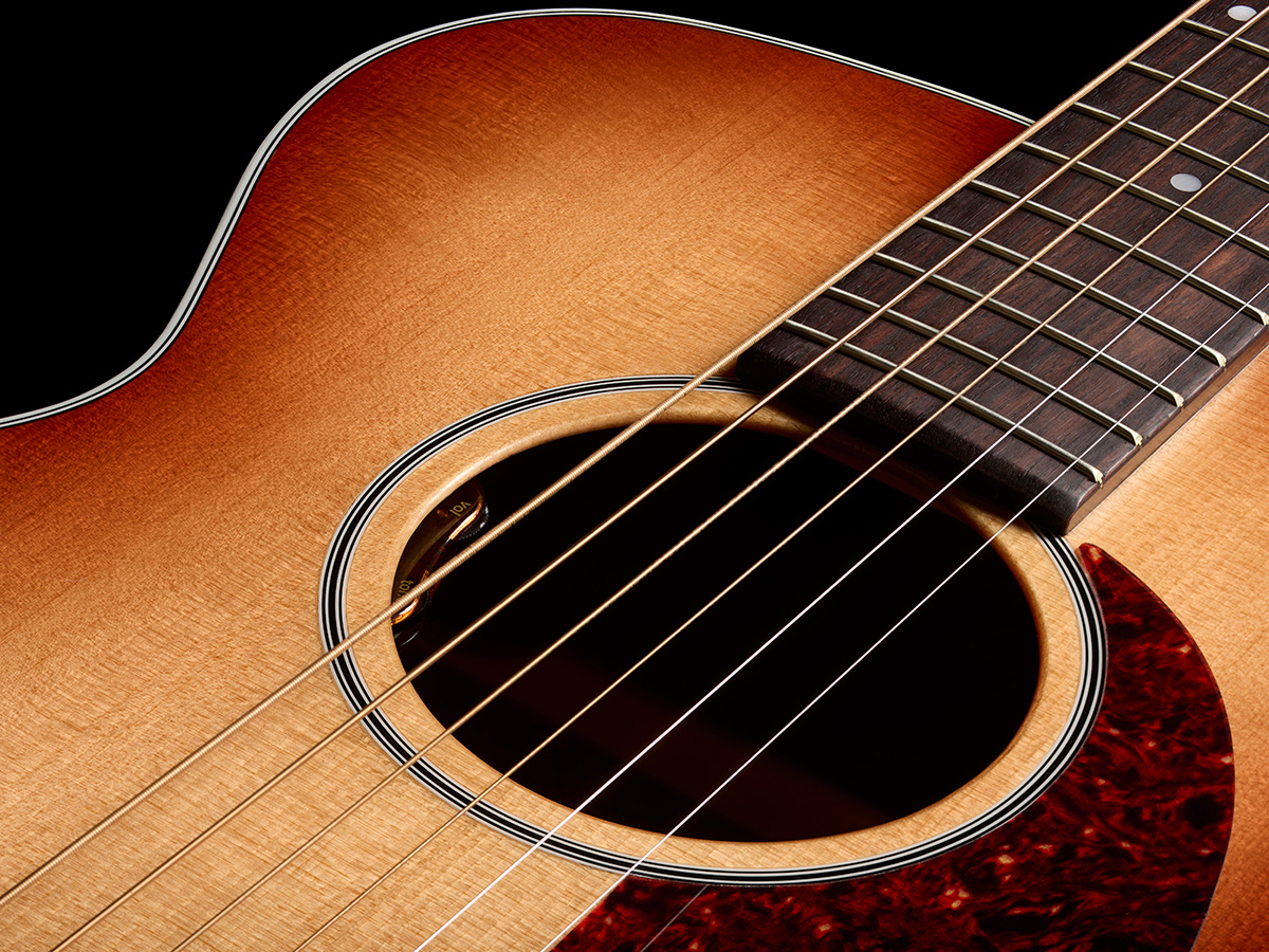 Close-up of M-40 Standard Pacific Sunset Burst soundhole showcasing the L.R. Baggs Element VTC pickup system