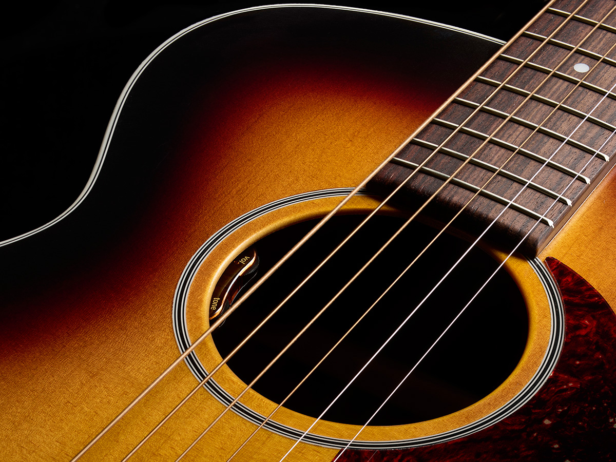 Close-up of M-50 Standard Antique Burst soundhole showcasing the L.R. Baggs Element VTC pickup system
