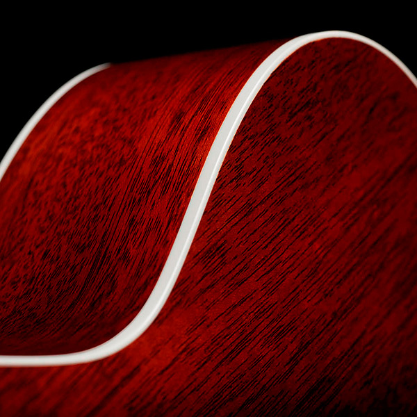 Close-up of M-40 Standard Natural back showcasing solid African Mahogany back and White ABS body binding thumb