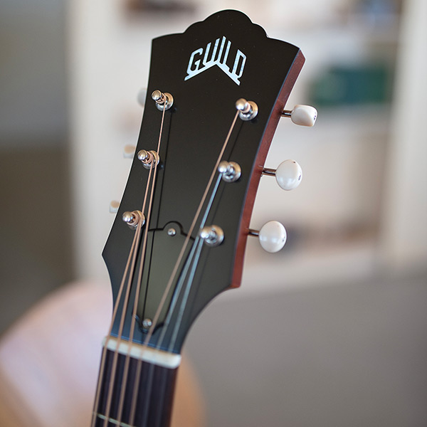Close up of D-40 Standard headstock with Guild peak logo thumbnail