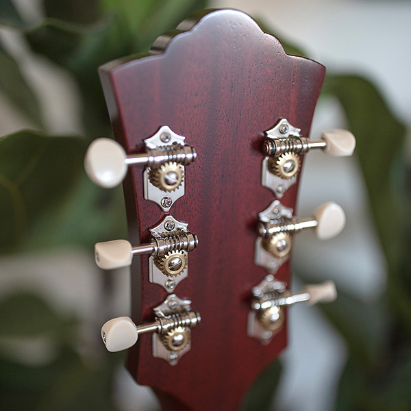 Close-up of the back of the  D-50 Standard Antique Burst headstock thumb