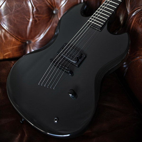 Polara Night Edition Tungsten laying on a leather couch thumb