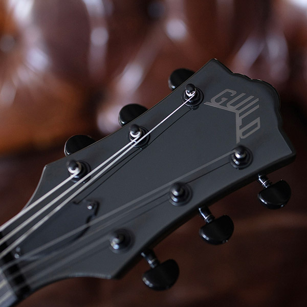 Close-up Polara Night Edition Tungsten headstock with Guild Peak logo thumb