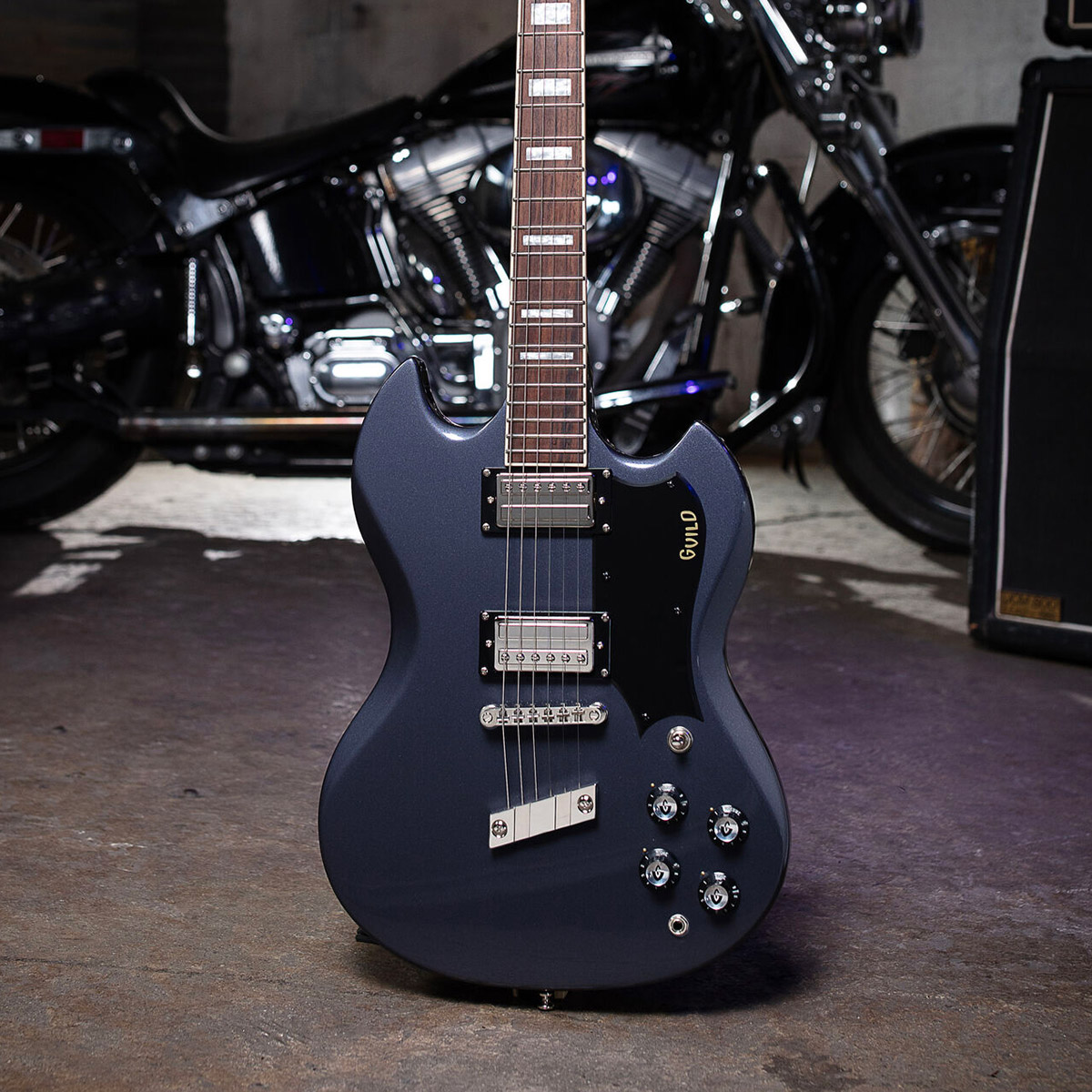 View of Polara Deluxe Canyon Dusk on concrete floor in front of a motorcycle