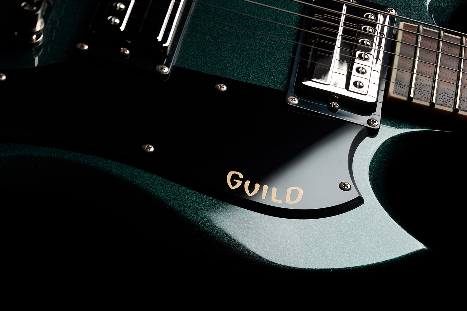 Close-up of Polara Deluxe Kingswood Green pick guard with Giuld logo