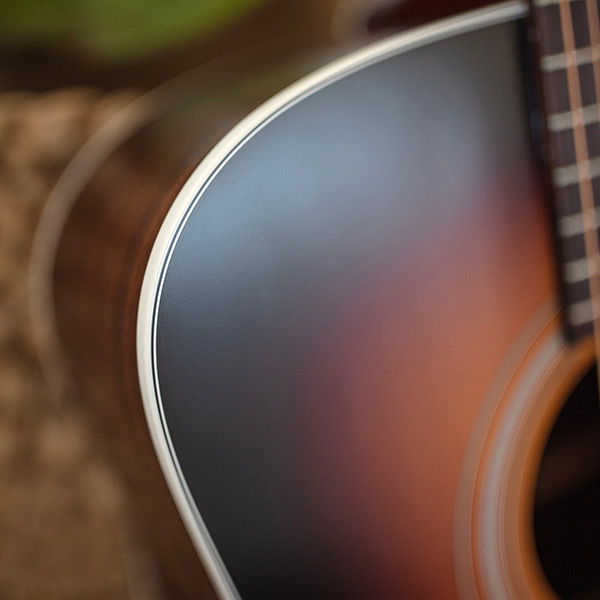 Close-up of D-50 Standard Antique Burst shoulder showcasing the body binding thumb