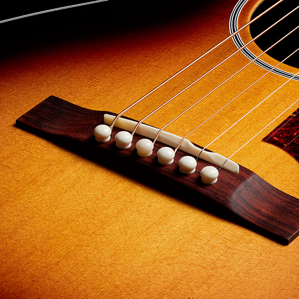 Close-up of the M-50 Standard Antique Burst bridge thumb