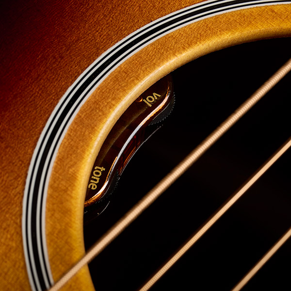 Close-up of M-50E Standard Antique Burst soundhole showcasing L.R. Baggs Element VTC pickup system thumb