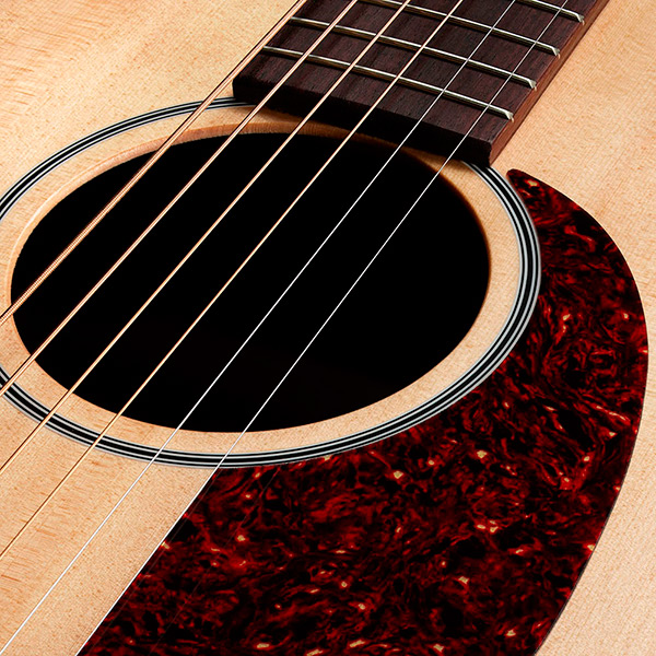 Close-up of M-50 Standard Natural soundhole thumb
