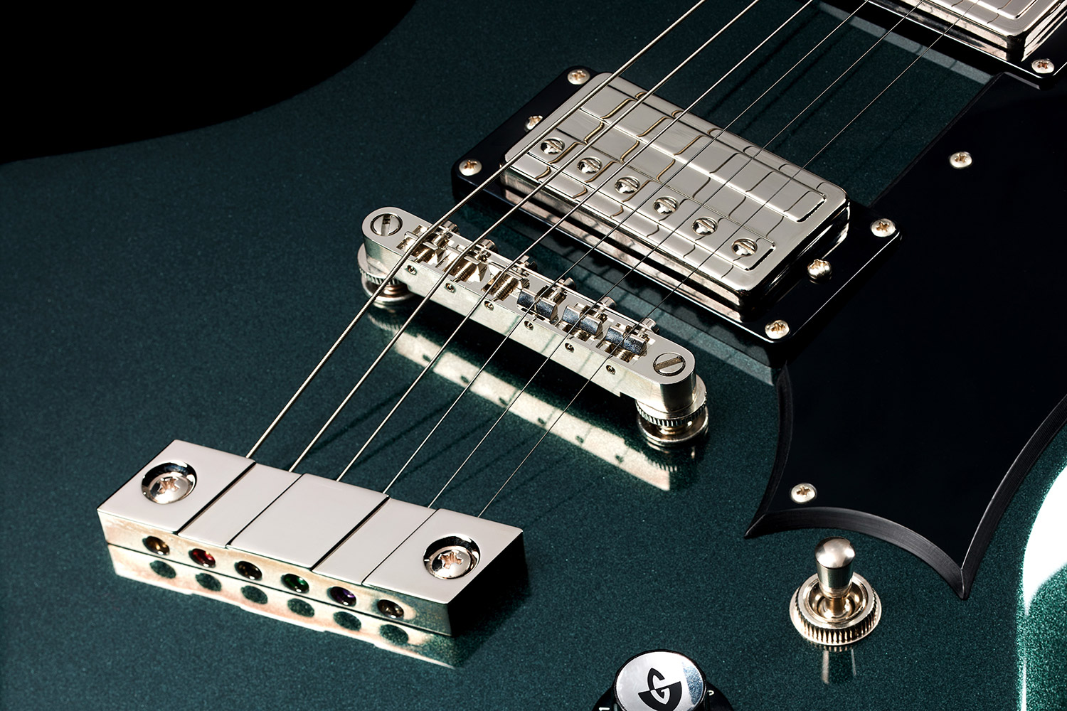 Close-up of front of the Polara Deluxe Kingswood Green saddle and pickups
