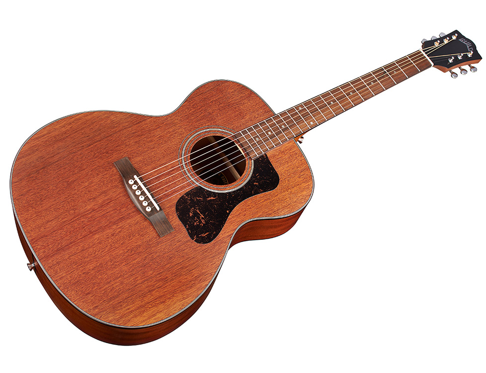 Angled front  view of the Guild OM-320 acoustic guitar