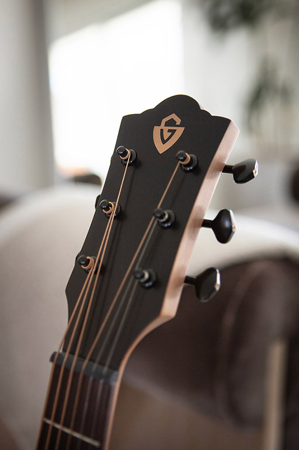 Close up of Travel Mahogany head stock with Guild logo thumbnail